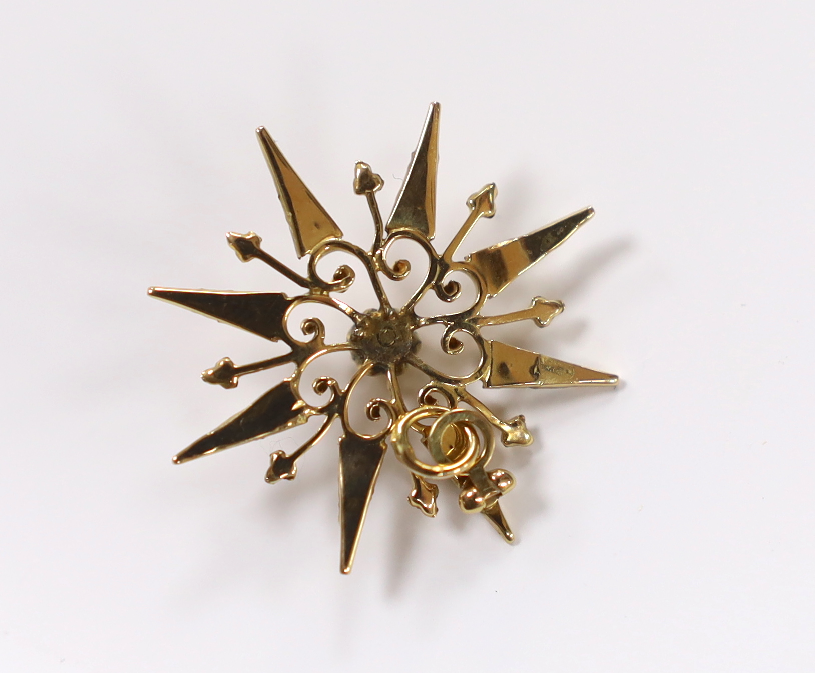 A yellow metal, rose cut diamond and seed pearl set starburst pendant, 27mm, gross weight 1.9 grams.